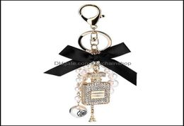 Keychains Fashion Accessories Creative Handmade Diy Diamond Per Bottle Alloy Bow Pearl Luxury Keychain Purses Charm Pendant Ys068 4147241