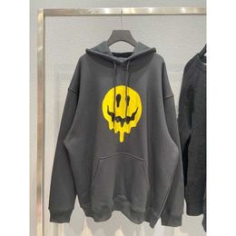 High quality designer clothing Paris dissolved smiling face printing back finger skull embroidery mens womens hooded sweater