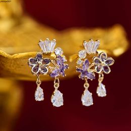 R602 Designers Exquisite Purple Zircon Flower Crown Womens Water Drop Light Luxury French High End Fashion Earrings