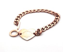 Whole foreign trade titanium steel hand chain heart button T letter thick bracelet 18K gold bracelet jewelry4310340