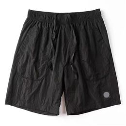 24 mais recentes bordados de nylon de metal bordado Stoneslands Small Mesh malha de shorts duplos casal de qualidade shorts minimalistas de rua alta