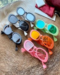 New fashion woman designer sunglasses 0517 color small frame uv 400 summer outdoor protective glasses avantgarde popular wholesal6851533
