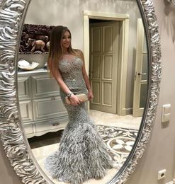 2018 New Silver Mermaid Feather Dresses Evening Wear Crystal Beaded Appliqued Sheer Jewel Neck Formal Prom Gowns Luxury Long Pagea8810553