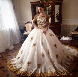 Sparkly Ball Gown Wedding Dresses Beaded Gold Lace Appliques Illusion Long Sleeves Crew Neck Zipper up Back Bridal Gowns with Cour9902124