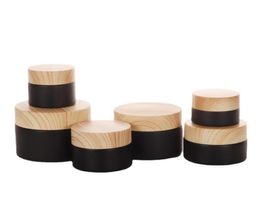 51015203050g Frosted Black Glass Refillable Cosmetic Jars Empty Cream Lip Balm Storage Container Pot With Wood Grain Lids7413842