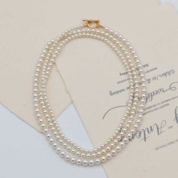 Japanese and Korean style long sweater chain imitates the Shi family round pearl chain a versatile high-end and niche necklace for women to wear
