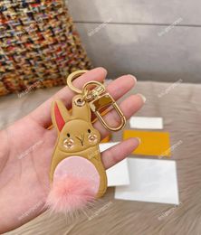 TZ Luxury Designer Keychain Little rabbit key buckle cute Pink tail Unisex Fashion Classic Brand Letter flower Design Gold Keychai3713531