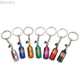 Keychains Lanyards Unique Mini Car Turbo NOS Keychain Nitrogen Bottle Metal Key Ring Stash Pill Box Storage Stylish Car Motorcycle Interior d240417