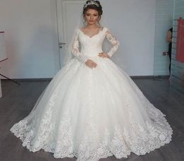 Gorgeous Sheer Ball Gown Wedding Dresses 2019 Puffy Lace Beaded Applique White Long Sleeve Arab Wedding Gowns robe de mariage3513194