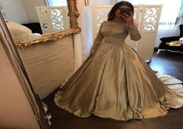 2018 Gold Quinceanera Dresses Ball Gown Bateau Long Sleeve Sweep Train Prom Dresses With Lace Applique Satin Evening Party Gowns4760169