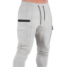 Mens muscle fitness running training sports cotton trousers mens breathable slim fit casual health pants pockets 240412