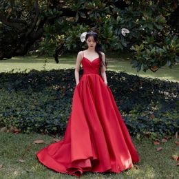 Vintage Long Red Satin V-Neck Celebrity Dresses With Pockets A-Line Spaghetti Straps Sweep Train Zipper Back Prom Dresses for Women