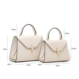 2024 new women's shoulder bag leather bag niche design fashion simple locking hand bill of lading shoulder oblique span women's bag large capacity