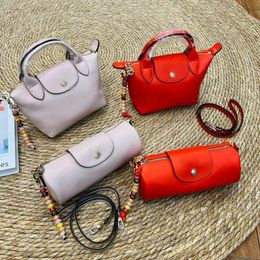 2024 New Fashionable Cowhide Womens Bag Beaded Single Shoulder Crossbody Cylindrical Penholder Dumpling