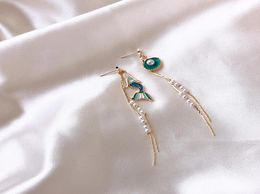 The daughter of the sea super fairy mermaid earrings asymmetric pearl shell tassel earrings lady temperament silver needle earring9039795