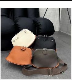 Buckets 2023 Popular New Lychee Pattern Cowhide Skateboard Bag Women's Wide Shoulder Strap Shell Bag Single Shoulder Bag Crossbody Bag