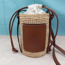 Designer bucket bag Single shoulder handbag New straw braided cylinder bag women's summer outdoor leisure holiday drawstring beach bag