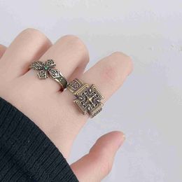 a Vintage Style Four Leaf Clover Cross Ring with a Light Luxury and High-end Temperament. Open Index Finger Ring for Men and Women