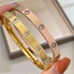 Wholesale Stocked Men Women Gold Stainless Steel Alloy Material Designer Bracelet