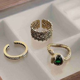 Light Luxury and High Quality Medium Antique Emerald Snake Shaped Cross Ring for Men and Women Heavy Industry Opening Index Finger Ring Joint Ring