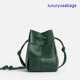 Womens Designer Cassette Cross-Body Bucket BotegaVeneta Mini/Small Sizes Intreccio Leather Cross-body Bucket Bag Interior Open Pocket Drawstring Closure 0DTR