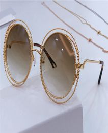 Fashion spiral pattern round retro frame new popular design sunglasses light color protection decorative glasses top quality 114s2535014