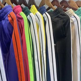 Erkek pantolon gevşek erkekler spor uzun pantolon fermuar pantolon sıradan erkekler eşofmanları mektup baskılı jogger yan çizgiler spor spor giyim drawstring st7025