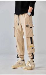Men's Pants Classic Design Multi Flap Pockets Cargo PantsMens Loose Fit Drawstring Harem Cargo Jogger Pants Y240422QUFK