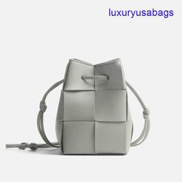 Womens Designer Cassette Cross-Body Bucket BotegaVeneta Mini/Small Sizes Intreccio Leather Cross-body Bucket Bag Interior Open Pocket Drawstring Closure PUGD