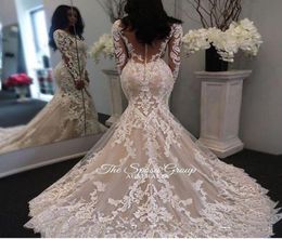 2019 New Illusion Long Sleeves Lace Mermaid Wedding Dresses Tulle Applique Court princess Wedding Bridal Gowns With Buttons1130197