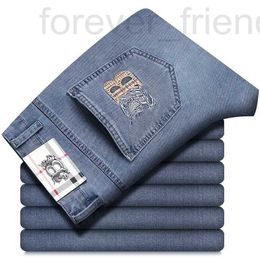 Jeans de jeans masculino 2023 Primavera/verão Fino de ponta de ponta letra de elástico direto da marca bordada calças casuais w65q