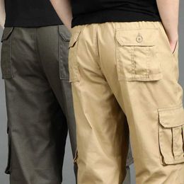 Męskie spodnie duże rozmiary rozciągliwe talii Polie Męskie Sporty Spodnie Wiele kieszeni spodnie dresowe hombre wędrówki do biegania spodni Y240422
