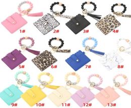 Fashion PU Leather Bracelet Wallet Keychain Party Favour Gifts Tassels Bangle Key Ring Holder Card Bag Silicone Beaded Wristlet Key2685617