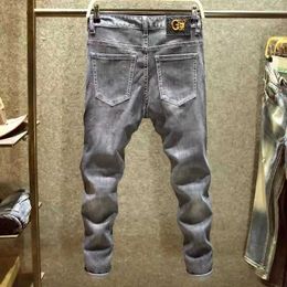 Herren vier Jahreszeiten schlanker pp gewaschener schwarzer heißer Bohrer Enge Stretch Casual Fashion Go-Go-Trend im Taillenloch kleine Beinjeans L2403