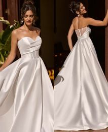Elegant Long Satin Sweetheart Wedding Dresses with Pockets A-Line Ivory Pleated Sweep Train Lace Up Back Simple Bridal Gowns for Women