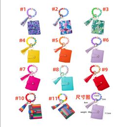 New hot-selling silicone bead bracelet key ring pu leather card bag fringe pendant magic key ring