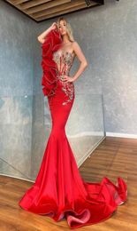 2022 Luxury African Bling Red Mermaid Prom Dresses One Shoulder Illusion Silver Beaded Crystal Sweep Train Ruffles Formal Party Dr8462887