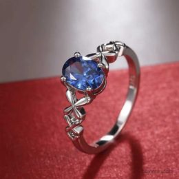 Bröllopsringar Romantiska Solitaire Blue Oval CZ -ring för kvinnor med Fancy Cross Twine Design Wedding Anniversary Party Fashion Jewelry