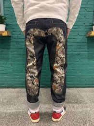 Autumn Winter Blessing God Guard Big M Golden Dragon Jacquard broderade lösa små fötter Fashion Brand Leisure Sports Men's and Women's Pants Iss 983343