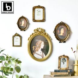 Frames WallMounted Retro Golden Photo Frame Vintage Classical Royal Resin Portrait Picture Frame Wedding Anniversary Home Decoration