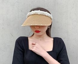 Summer Female Straw Hat Handmade Pearl Beach Grass Empty Hat Women Sun Visor Fashion Retro Celebrity Cap1463882