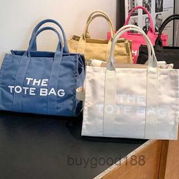 Designer Women's Mc Tote bag 2024 Summer New Canvas Fashion Trend Versatile Travel Essential Shoulder Bag
