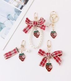 Keychains Lovely Red Plaid Ribbon Strawberry Keychain Women Girl Jewellery Simulated Fruit Bowknot Bag Car Key Holder Keyring Birthd4122749