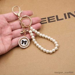 Tornari perletti vintage perle perle bracciale portachiavi alla tendenza del polso alla moda per le donne per le donne.