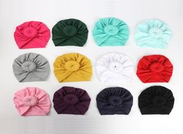 12 Colours Cute Infant Toddler Unisex Ball Knot Indian Turban Kids Spring Autumn Caps Baby Donut Hat Solid Colour Cotton Hairband C39080821