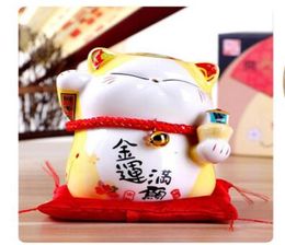Lucky Cat ornaments Home Furnishing ceramic jewelry creative savings piggy bank shop opened a felicitous wish of making money 13CM4629386