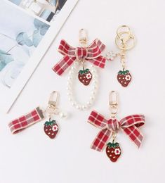 Keychains Lovely Red Plaid Ribbon Strawberry Keychain Women Girl Jewellery Simulated Fruit Bowknot Bag Car Key Holder Keyring Birthd2992512