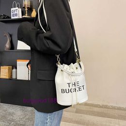 Luxury designer MioZj bucket bag Fashionable style Womens Bag New PU Texture Letter Water Bucket Crossbody