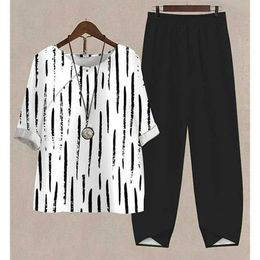 Kvinnors tvåbitar byxor Fashion Women Casual Loose Pants Set Spring Summer Stripe Print Loose Outfits Overized O Neck Top Suit Pullover Lady Tracksuit Y240426