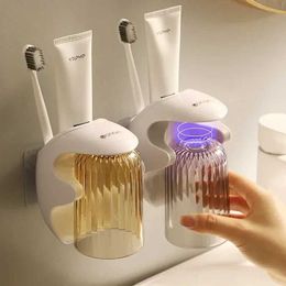 Toothbrush Holders 2024 new simple magnetic suction cup wall mounted household washing cup set dental cup holder toothbrush storage box 240426